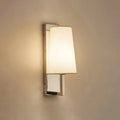 Modern brushed nickel wall sconce with a soft white fabric shade and direct wired electric bulb base e26 e27