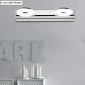 Modern chrome 2 head wall lighting fixture with circular softly glowing bulbs for bathroom wall installation