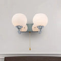 Modern chrome and cream glass wall light bedroom sconce with pull chain