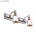 Modern chrome and rose gold vanity wall light with two warm-toned glass shades included in product includes