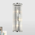 Modern chrome clear crystal shade wall light featuring cylindrical design with vertical glass rods and filament bulbs