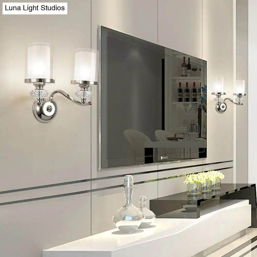 Modern chrome dual cylinder bathroom sconce with curvy arm