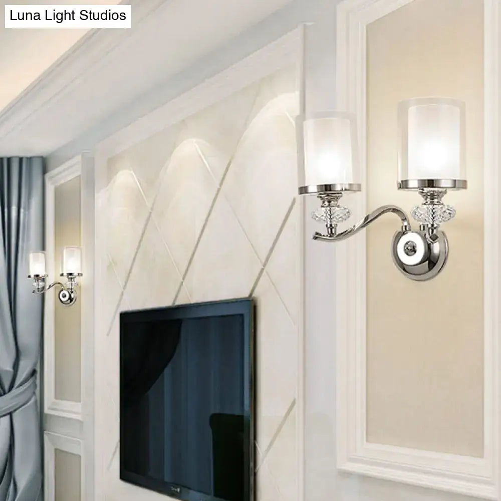 Modern chrome dual cylinder bathroom sconce with curvy arm