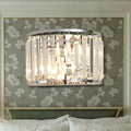 A modern wall lamp with clear crystal rods and a chrome finish for elegant bedroom lighting with e12 e14 bulbs