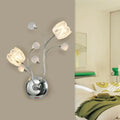 Modern chrome wall lamp with swirling arm, flower shade, three glass tulip lights, and four frosted spherical accents