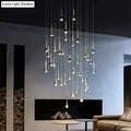 Modern chrome-finished led water drop chandelier with slender trumpet-shaped fixtures suspended at varying heights