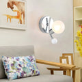 Modern chrome sconce with dual globe glass shades featuring a chrome finish for elegant living room lighting