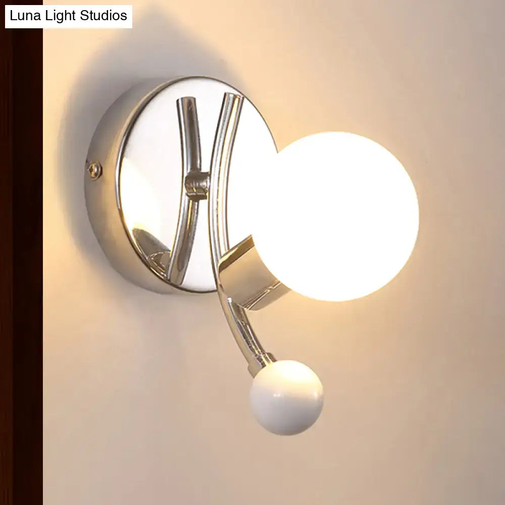 Modern chrome sconce with dual globe glass shades for living room
