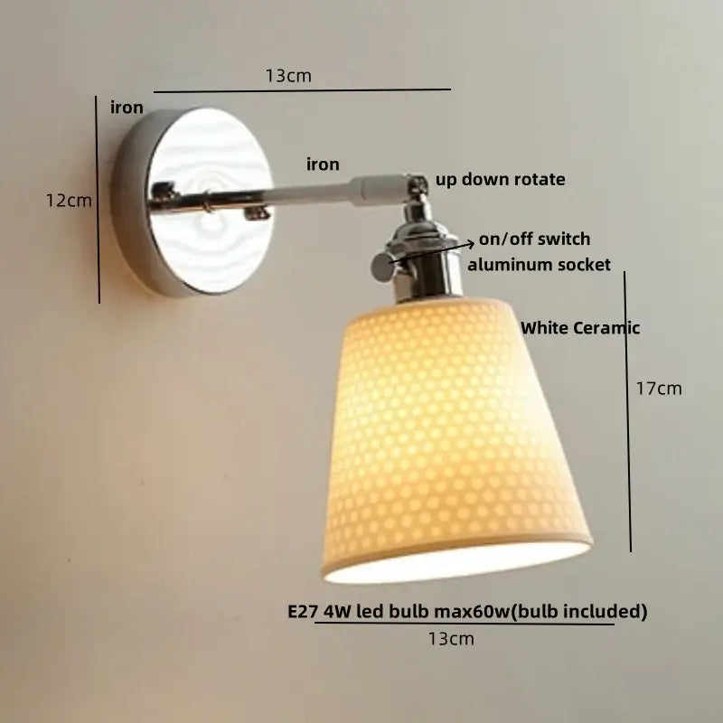 Modern chrome wall light with perforated fabric shade for bedroom