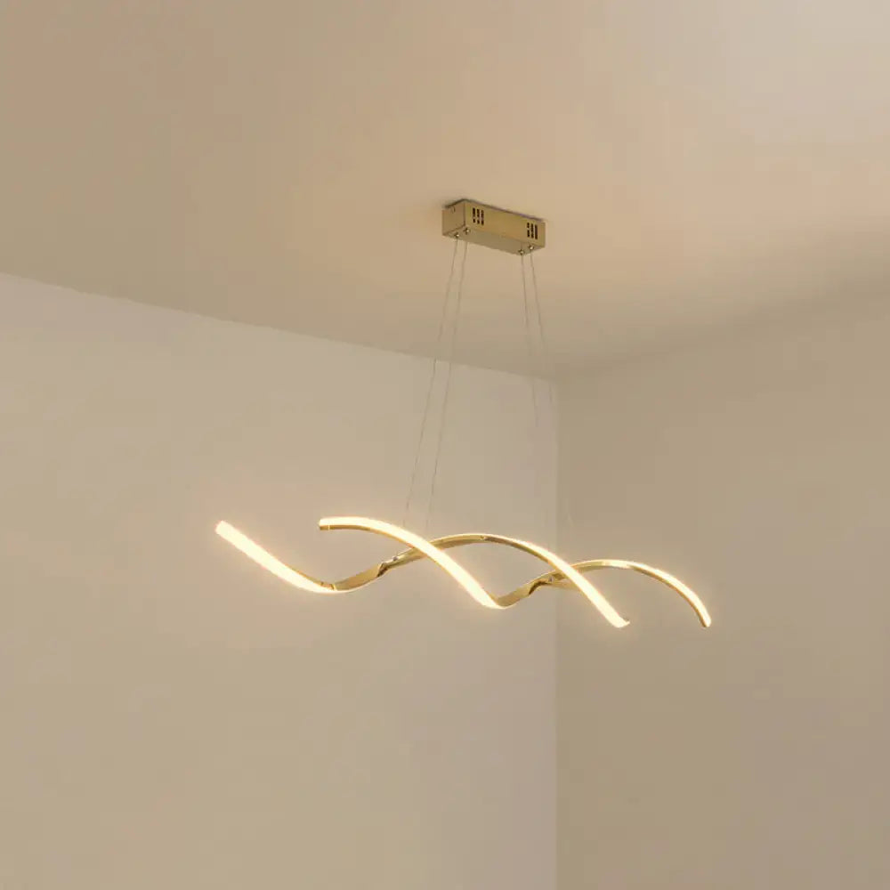 Gold-toned modern chrome wave led island lighting with sleek curved design and warm ambient kitchen pendant light