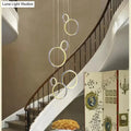 Modern decorbites circle led crystal pendant lamp with glowing rings suspended by thin cords for dining room lighting