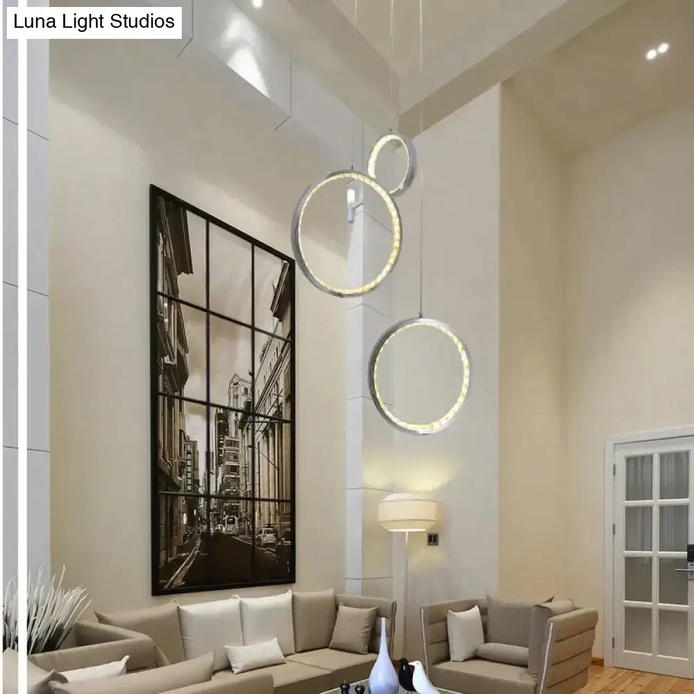 Modern circular pendant lamp with illuminated edges featuring circle led crystal design for dining and living rooms
