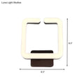 Modern cream square direct wired electric wall sconce with dark brown base providing warm white natural light