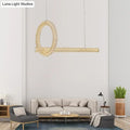 A modern gold-toned key-shaped cut crystal ceiling light pendant with textured surface for 220v-240v kitchen island
