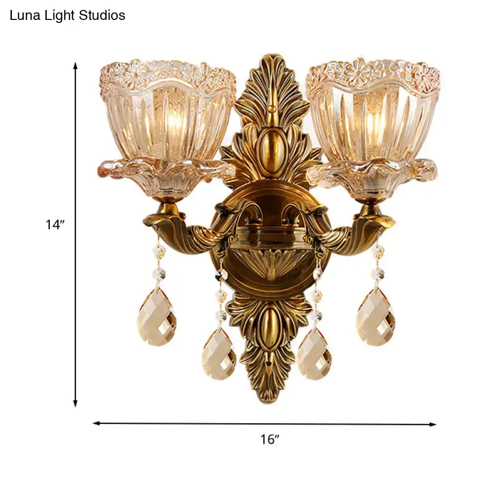 Modern floral brass wall sconce with teardrop crystal drop living room