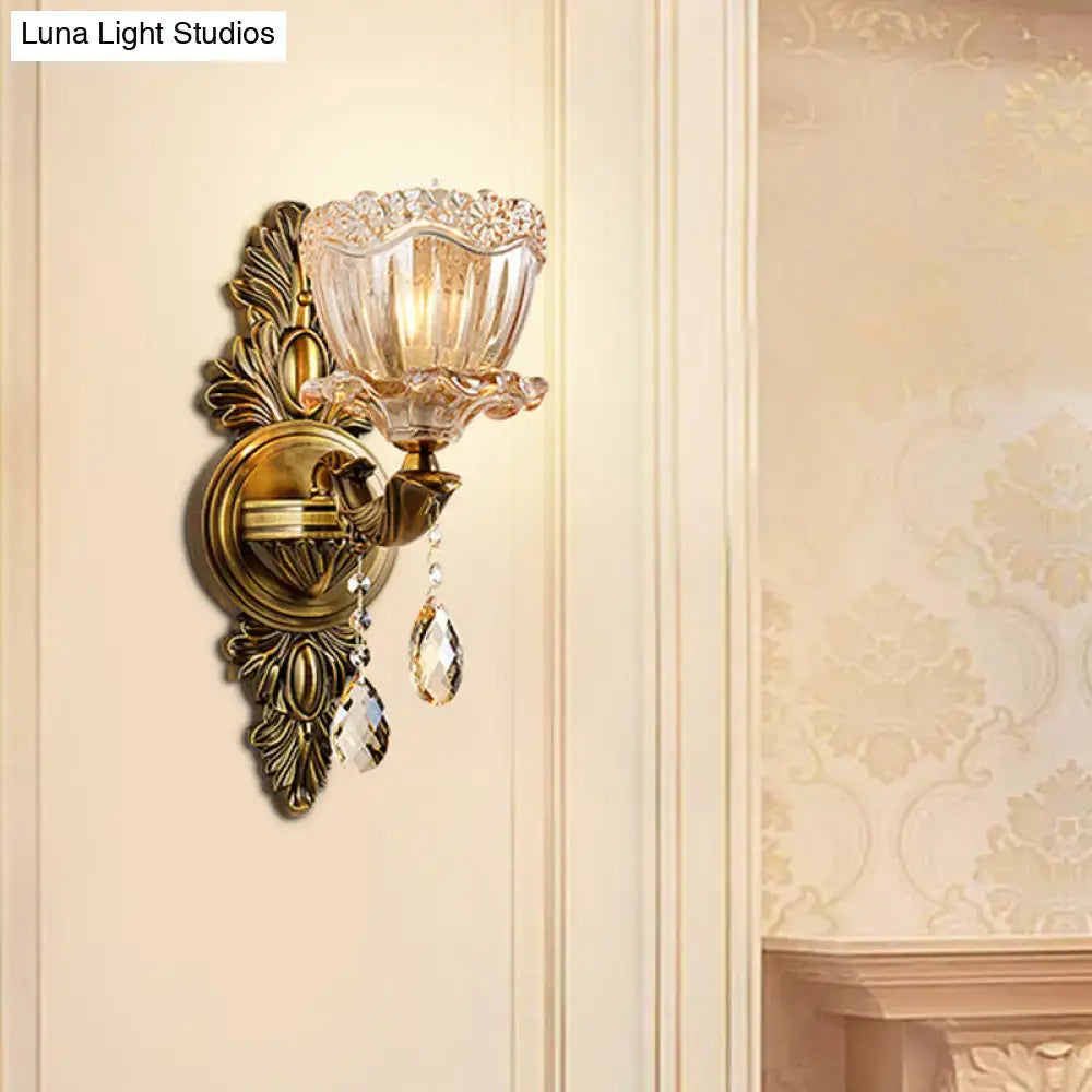 Modern floral brass wall sconce with teardrop crystal drop living room