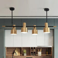 Modern gold and black drum pendant light for dining room island