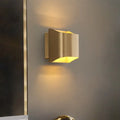 Modern gold angular led wall sconce with sleek design and warm yellow light for living room lighting fixture