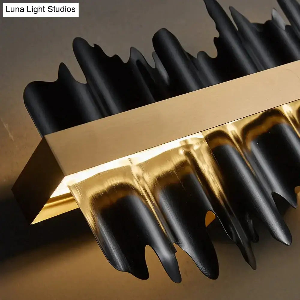 Black and gold metallic decorbites™ irene led chandelier lighting with sculpted wave-like arms for dining room use
