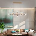 Modern gold chandelier with clear glass globes for dining room