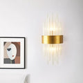 Modern gold crystal rod wall sconce with clear glass rods radiating from a circular base for 110v-120v use
