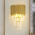 Modern gold crystal wall sconce with vertical brass tubes and clear crystal prisms e14 light type for living room