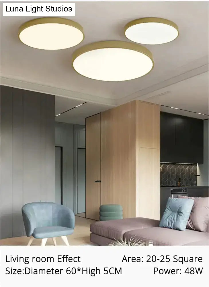 Three circular ceiling lights with gold-toned metallic rims and soft white illumination for indoor living spaces