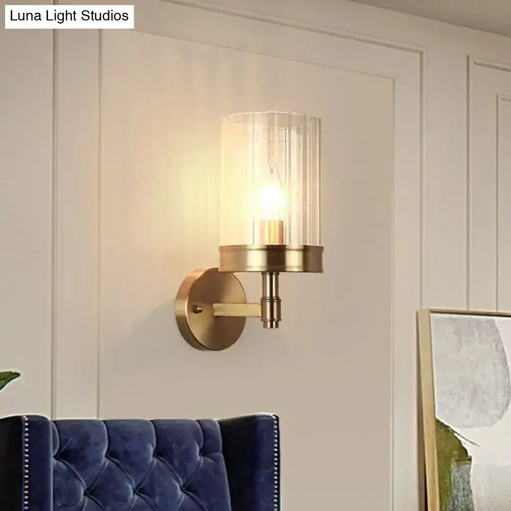 Modern gold finish wall light with glass shade – bedroom sconce