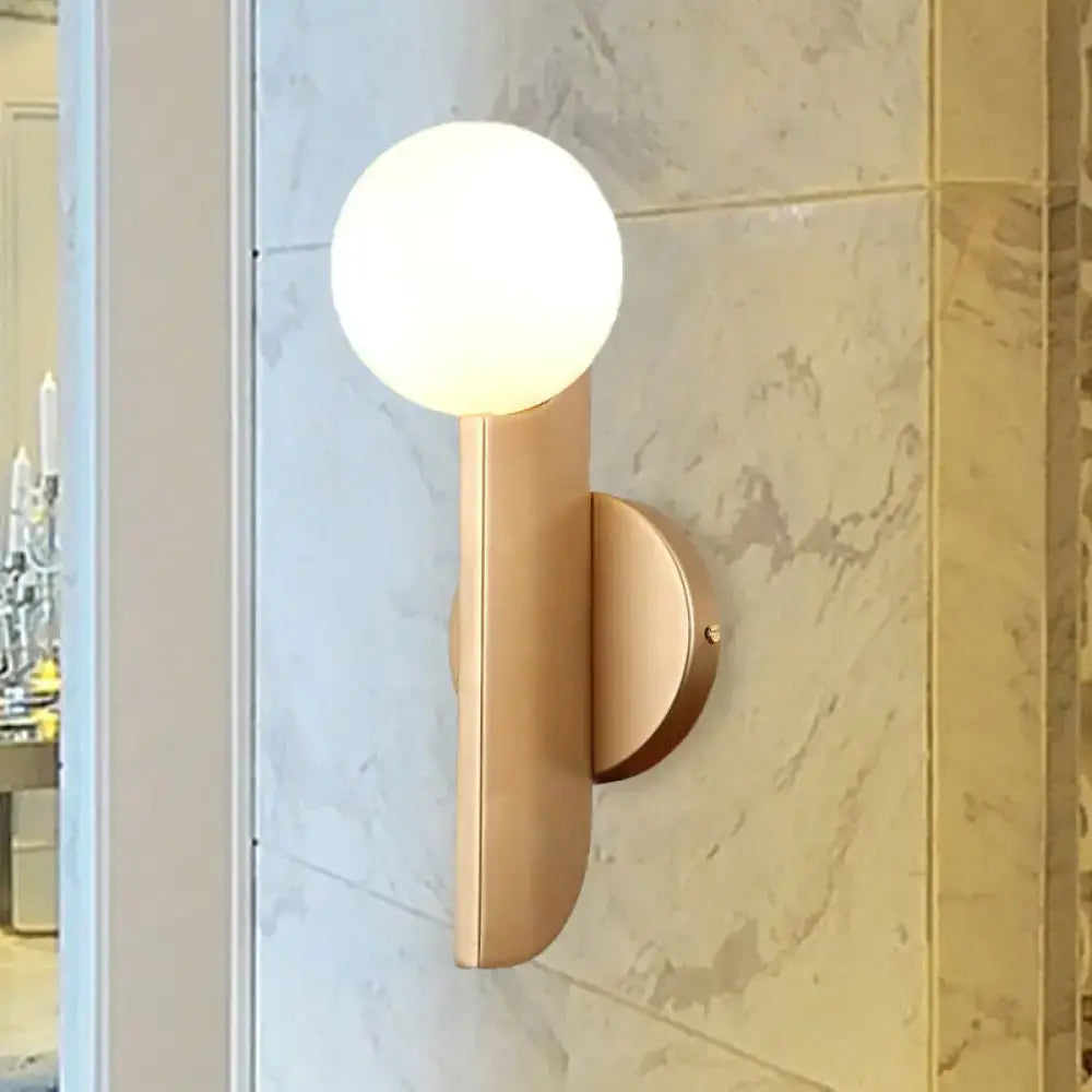 Modern gold finish wall sconce with milky glass shade bedroom light