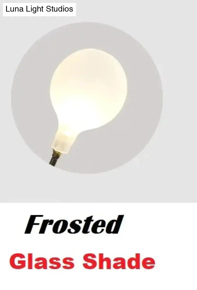 Modern gold firefly tree branch led wall light with frosted glass bulb and soft diffused glow for bedroom lighting