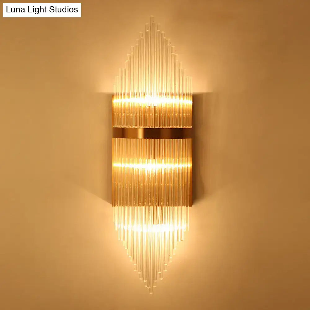 Modern gold geometric wall sconce with clear glass for living room