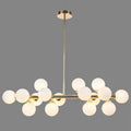 Modern gold island pendant light with frosted glass globe bulbs in a symmetrical branching design for living room