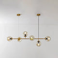 Modern gold island pendant light with brass chandelier design clear glass globe bulbs and black cords for dining room