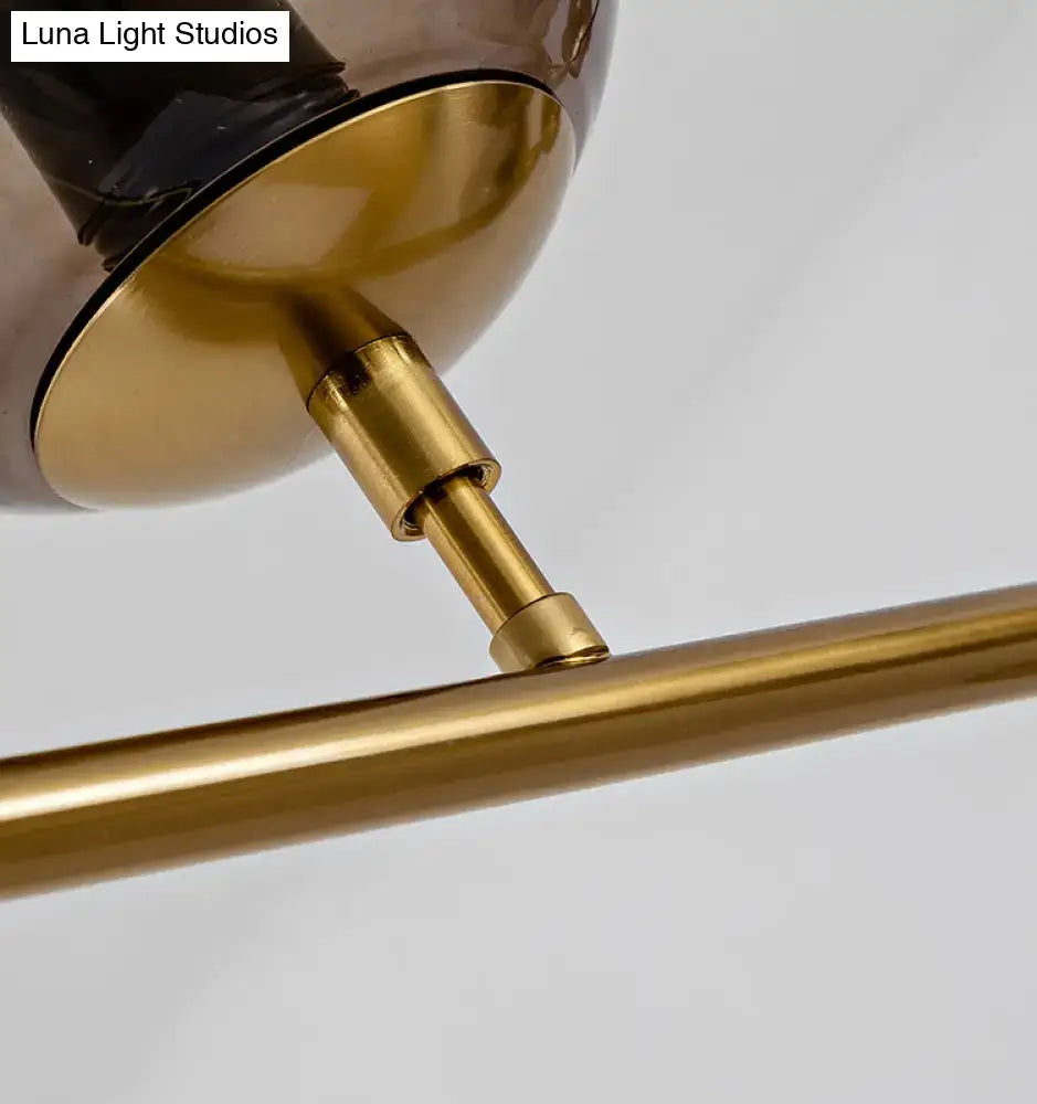 Modern gold island pendant light with glass globes for dining room