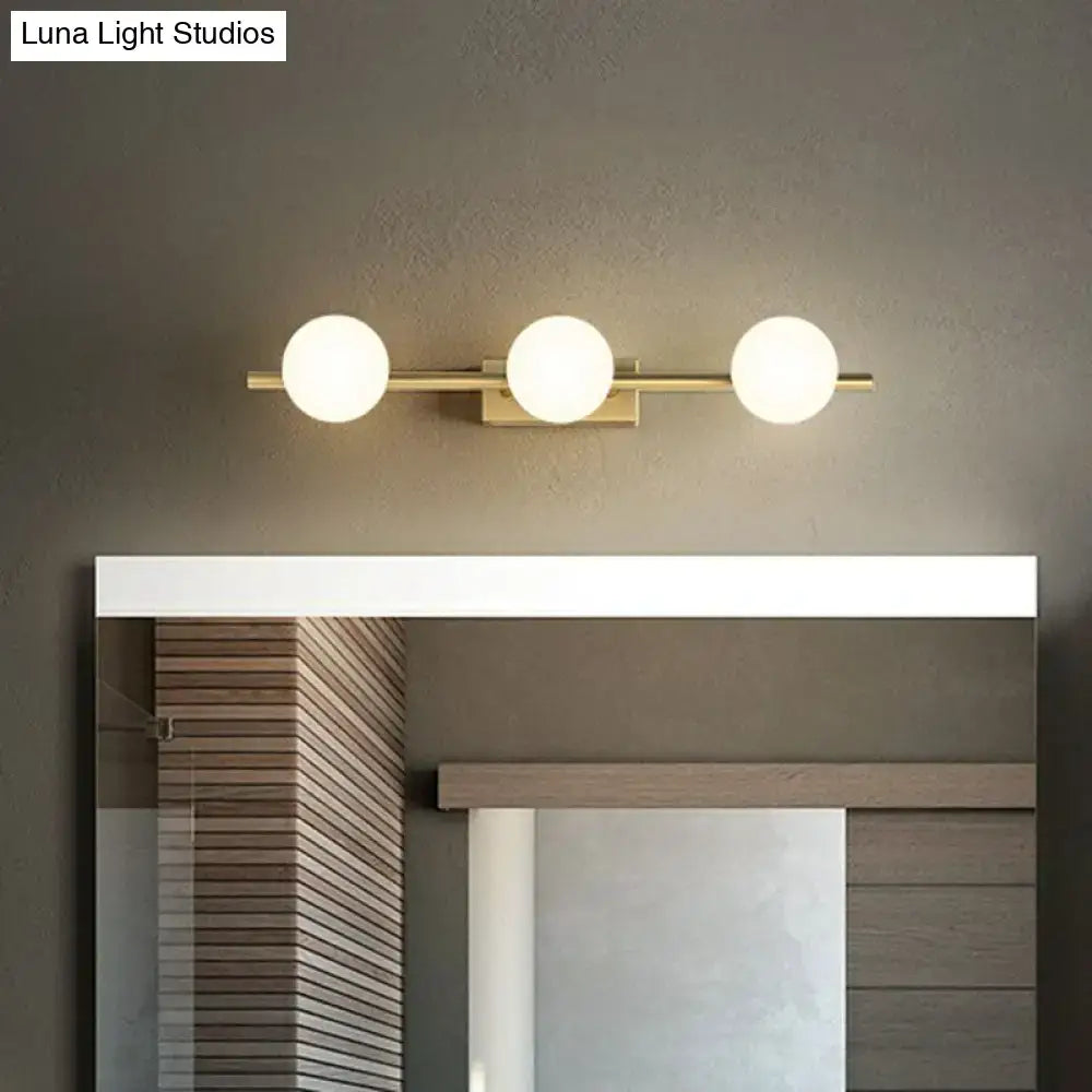 Modern gold linear wall sconce with milky ball glass for bathroom