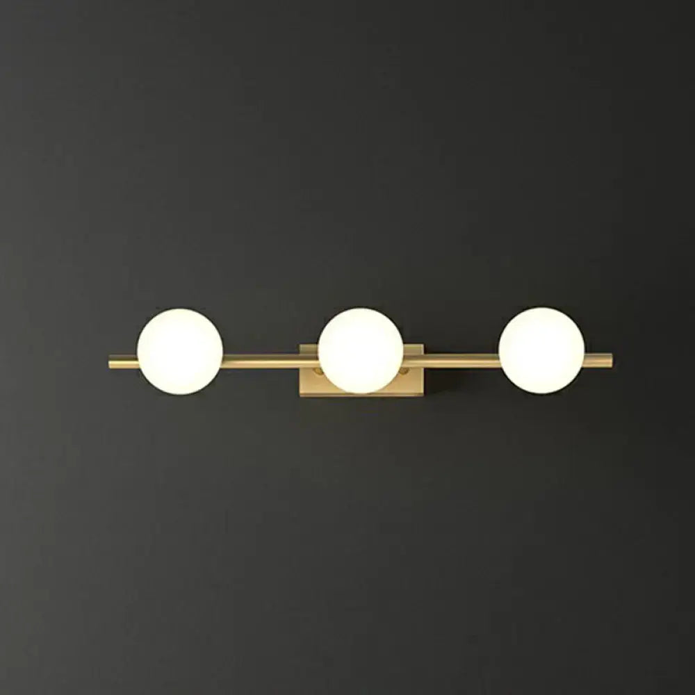 Modern gold linear wall sconce with milky ball glass for bathroom