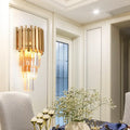 Modern gold wall light with vertical brass bars and cascading crystal prism tiers for dining room wall lamp