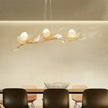 Decorbites™ modern gold nest island pendant chandelier with three white bird figurines on a gold nest design