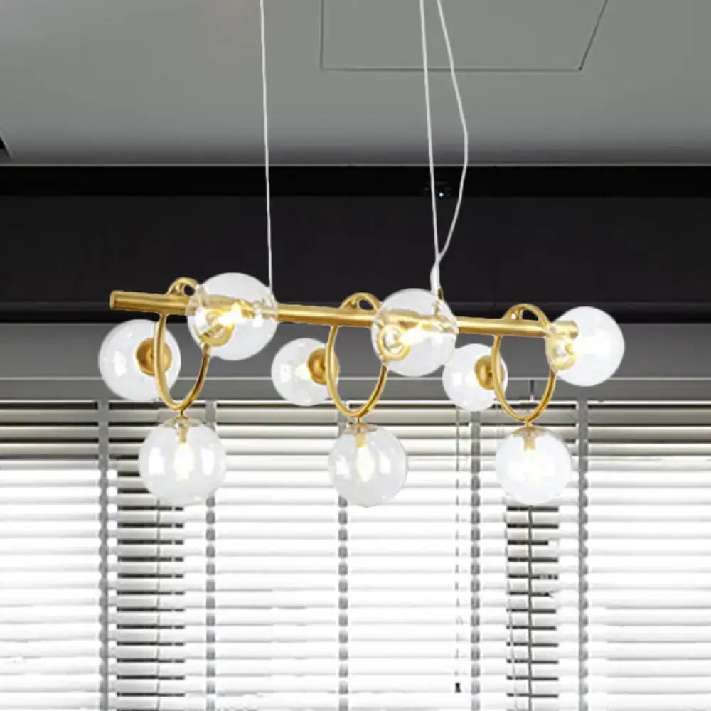 Modern gold pendant light with clear cognac glass for dining room
