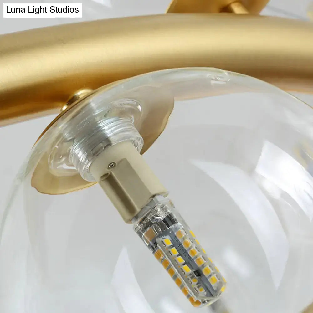 Modern gold pendant light with clear cognac glass for dining room
