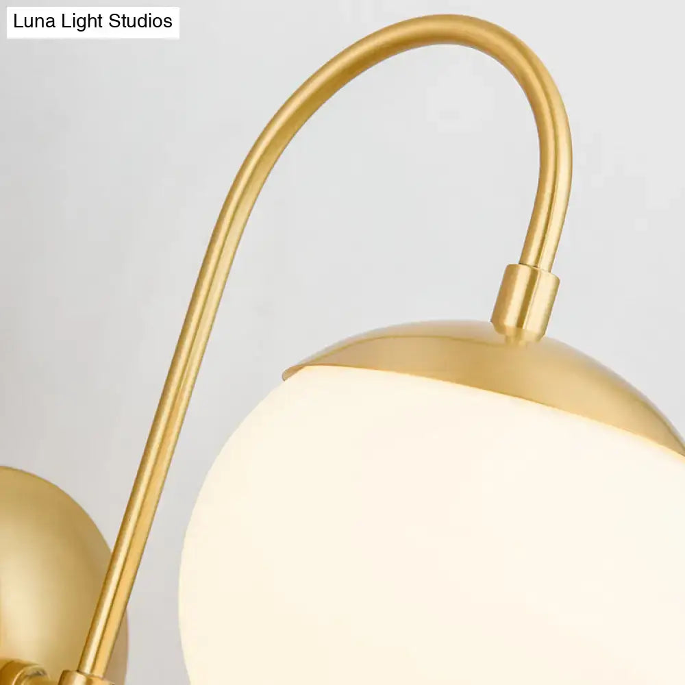 Modern gold round wall lamp with opal glass for bedroom