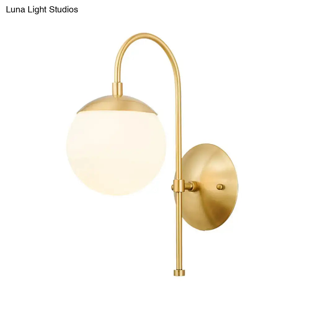 Modern gold round wall lamp with opal glass for bedroom