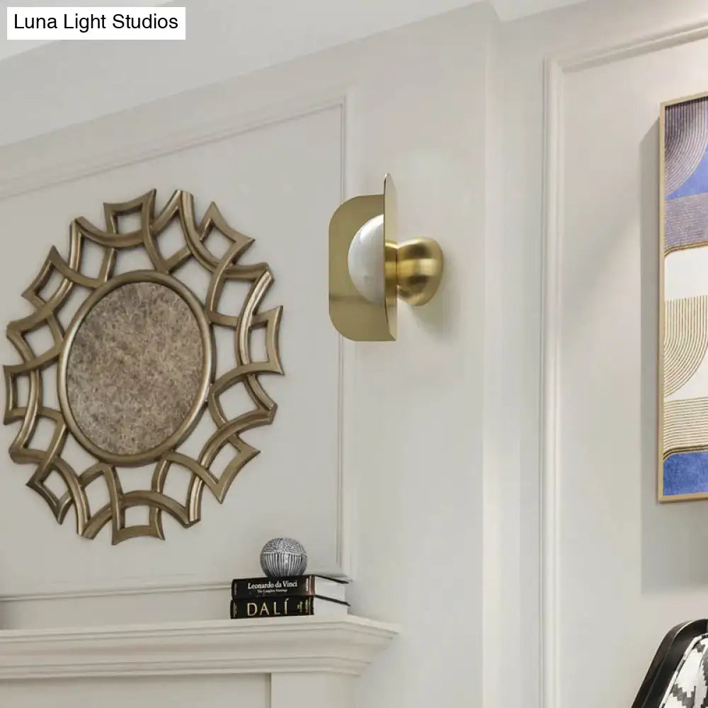Modern gold sconce light with curved metal shade bedroom lamp