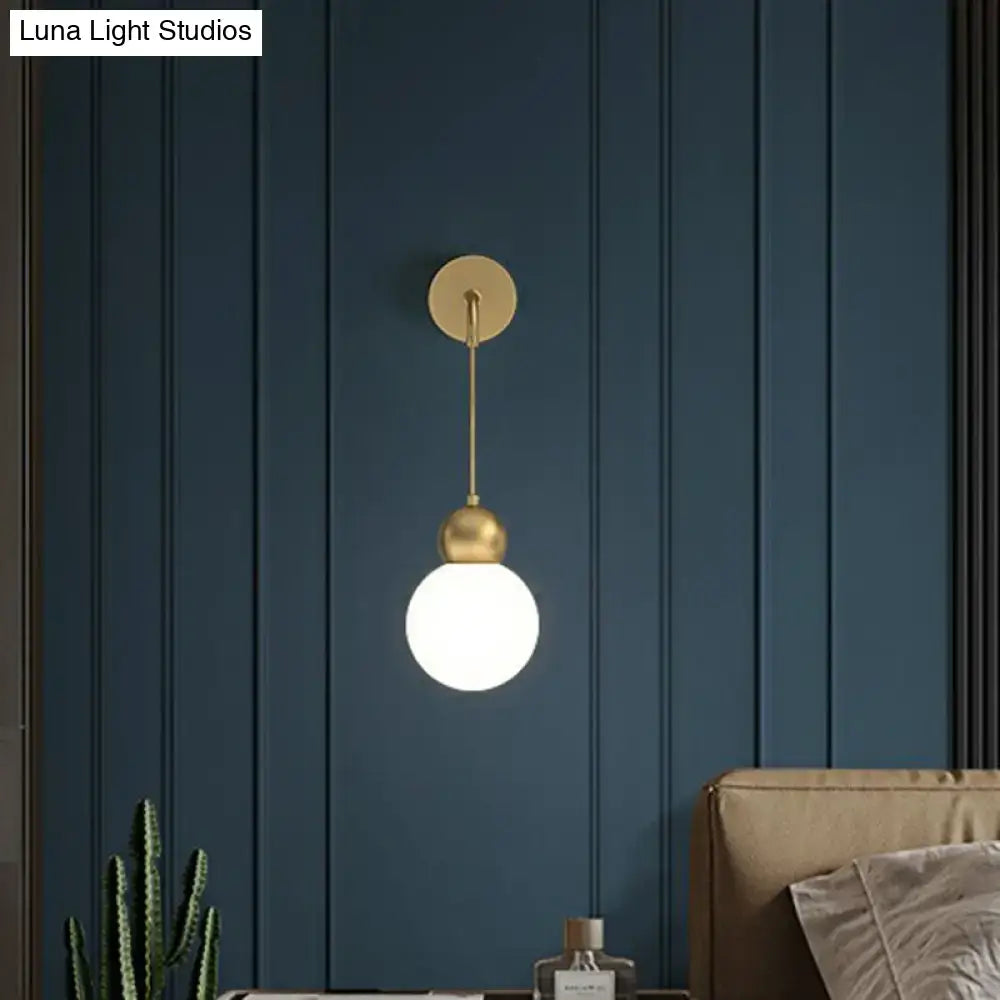 Modern gold sconce light with milky glass – bedroom wall lamp