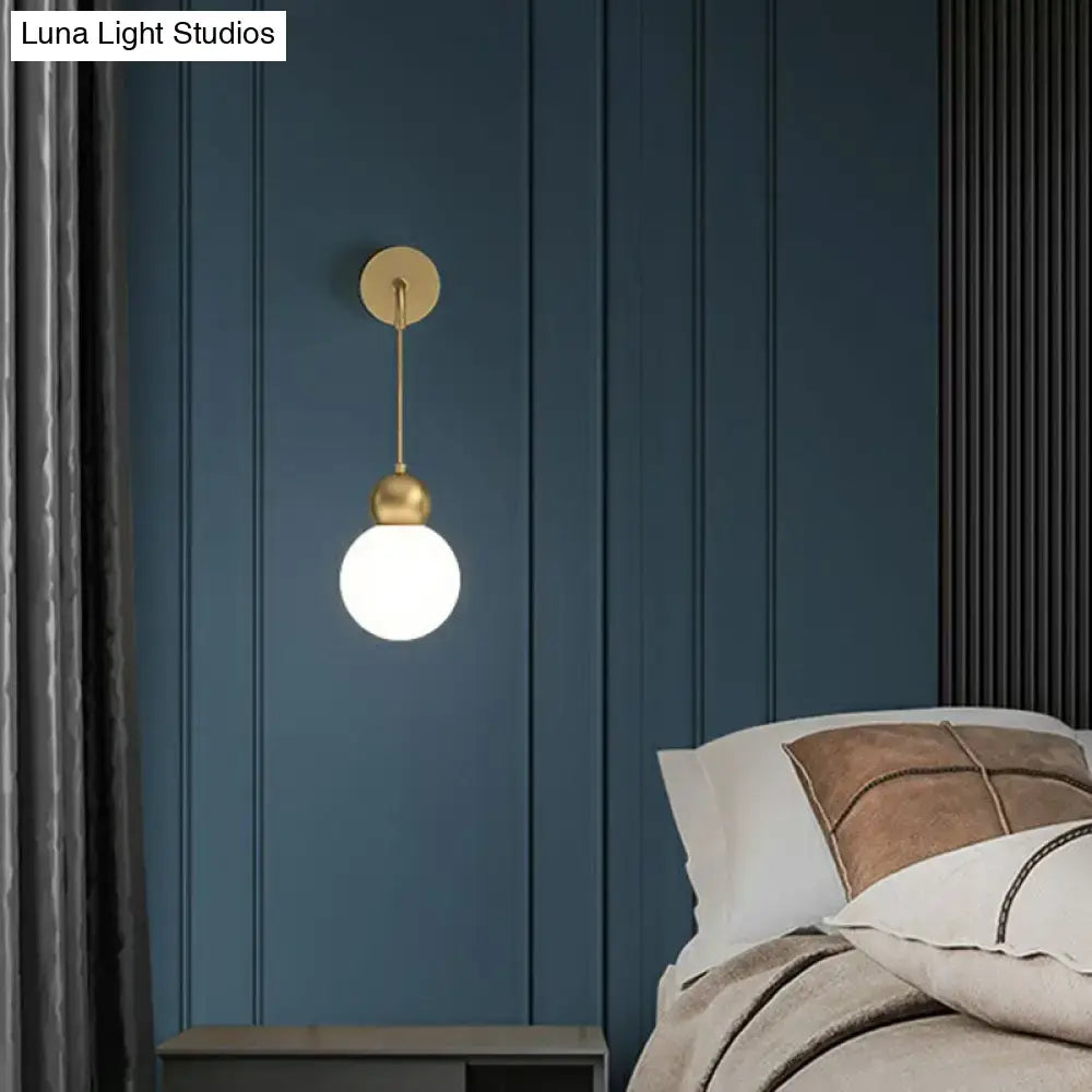 Modern gold sconce light with milky glass – bedroom wall lamp
