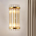 Modern gold wall lamp with crystal rod shade featuring vertical clear glass rods for elegant bedroom sconce lighting