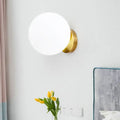Modern gold wall lamp with opal glass shade bedroom light