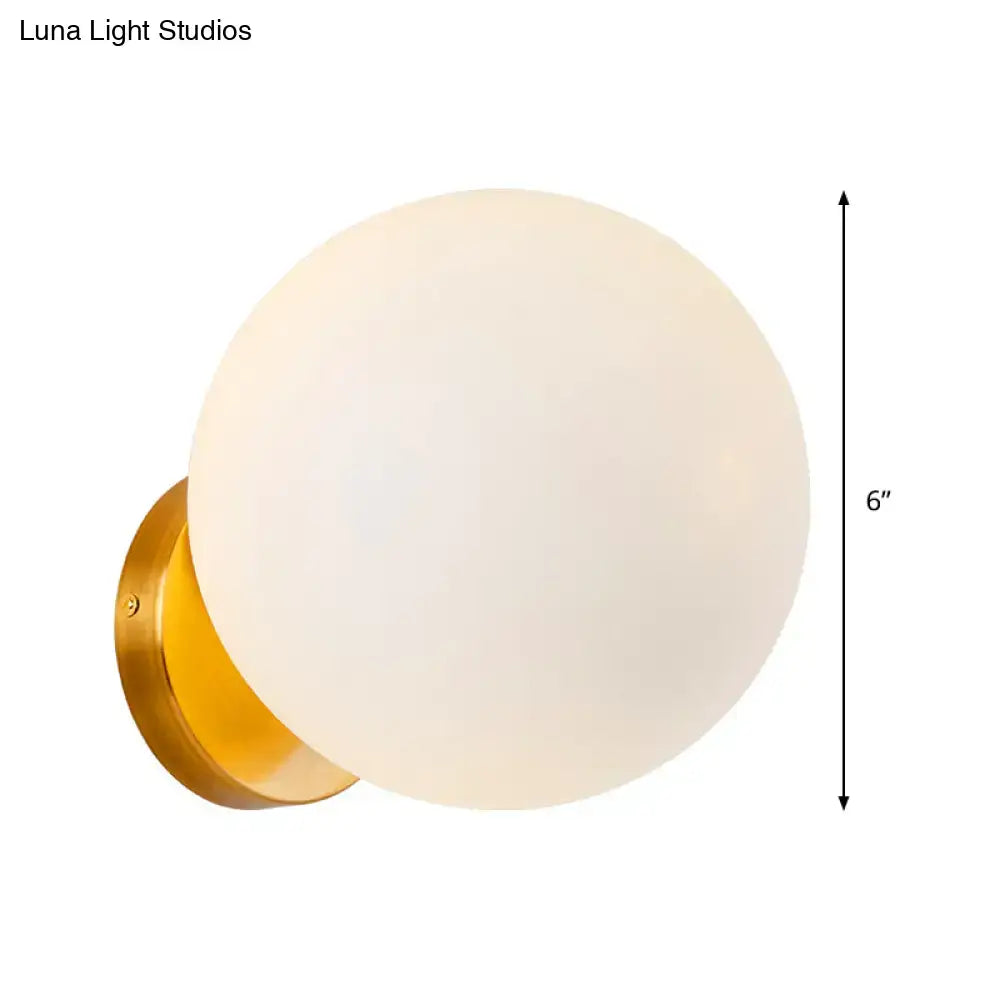 Modern gold wall lamp with opal glass shade bedroom light