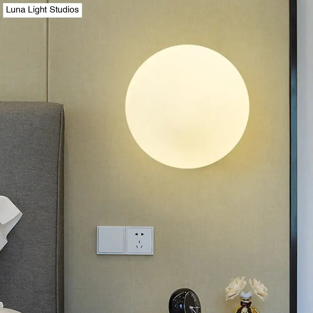 Modern gold wall lamp with opal glass shade bedroom light