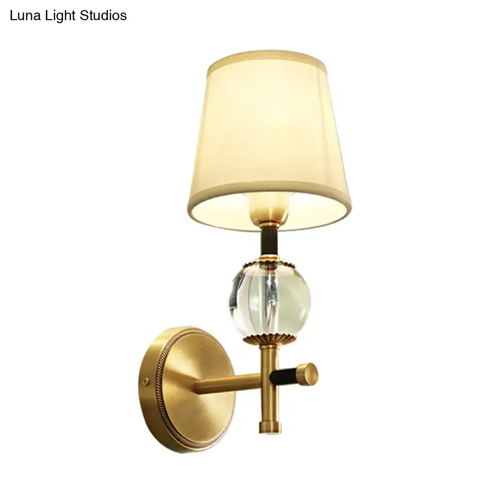 Modern gold wall light with crystal and fabric shade bedroom